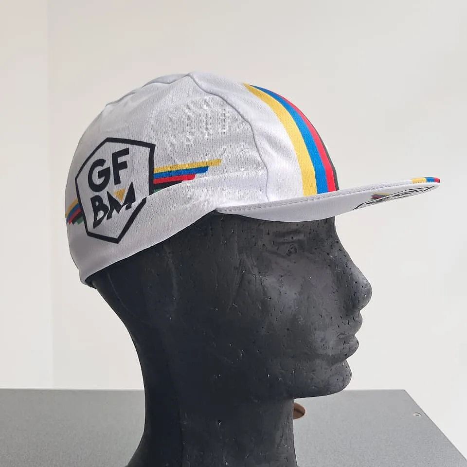 White GFBM cycling cap on a mannequin, three-quarter view with the crest at the front
