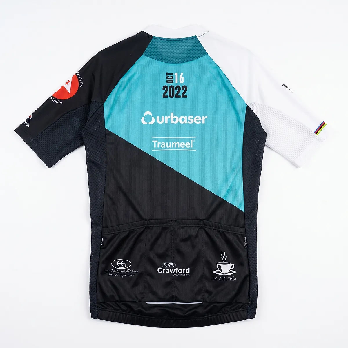 Back of the 2022 jersey, white and black with turquoise blue and the urbaser and Traumeel logos